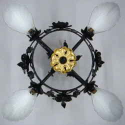 The chandelier seen from below, with its gilded central floret