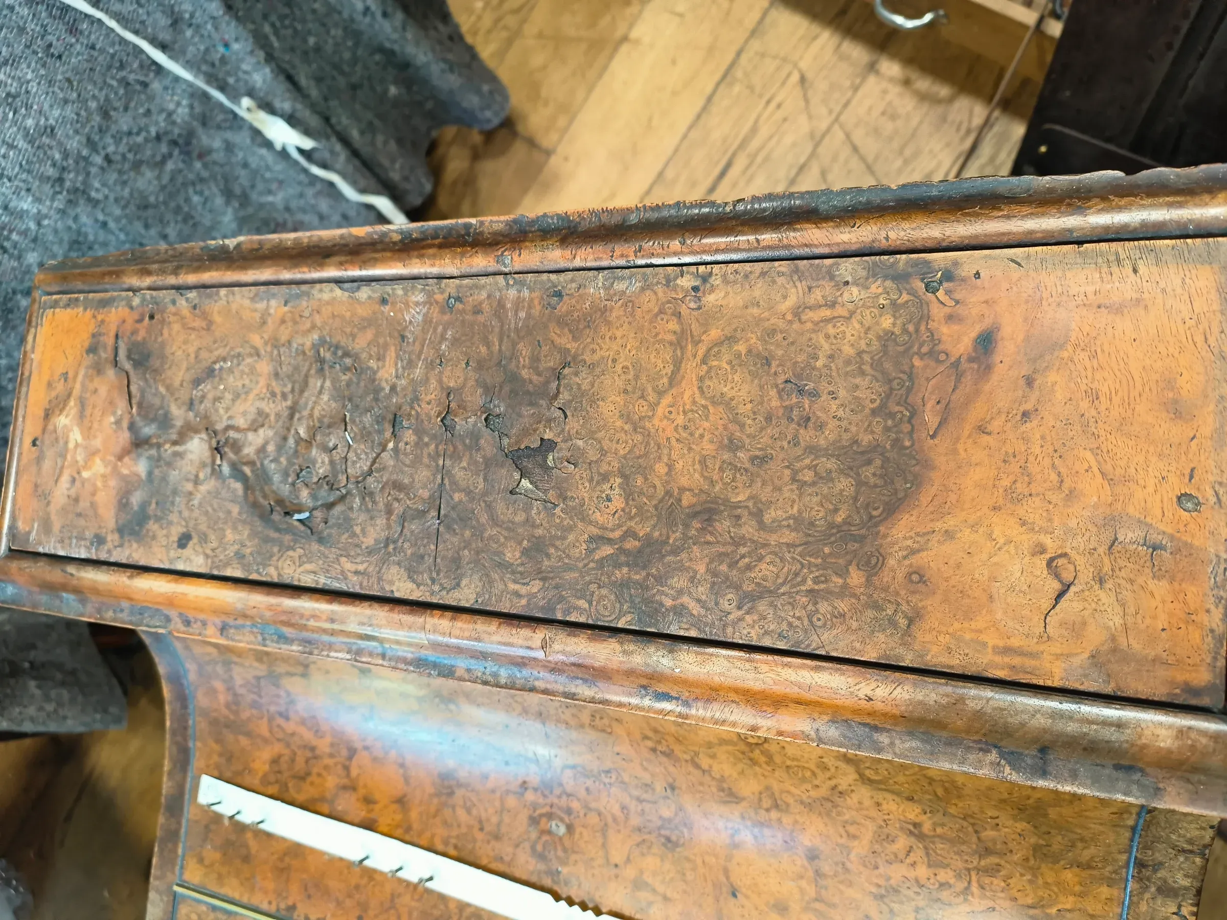 Lost walnut veneer and a missing gallery