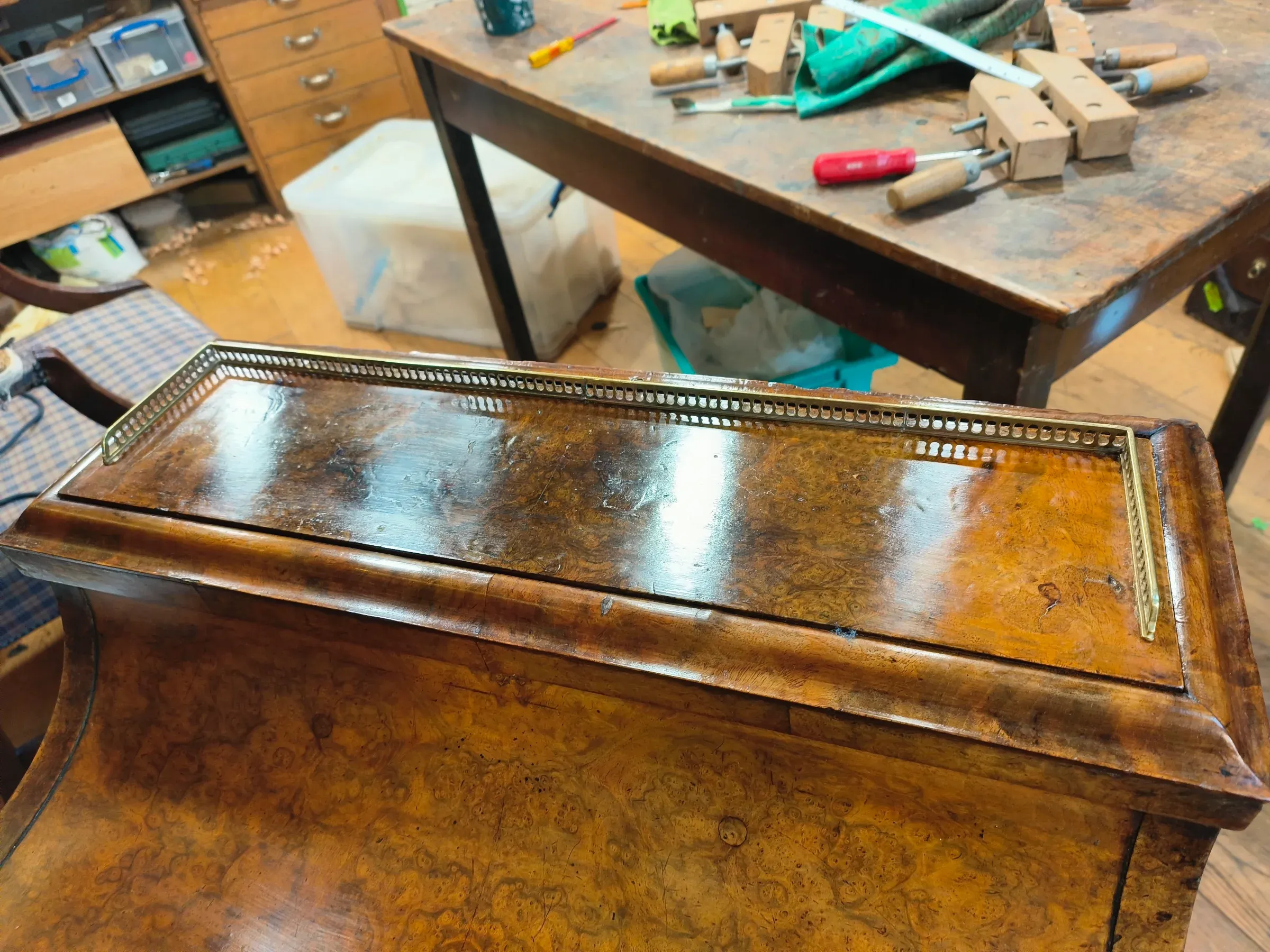Shown after veneer replacement, polishing and fitting of the bespoke brass gallery