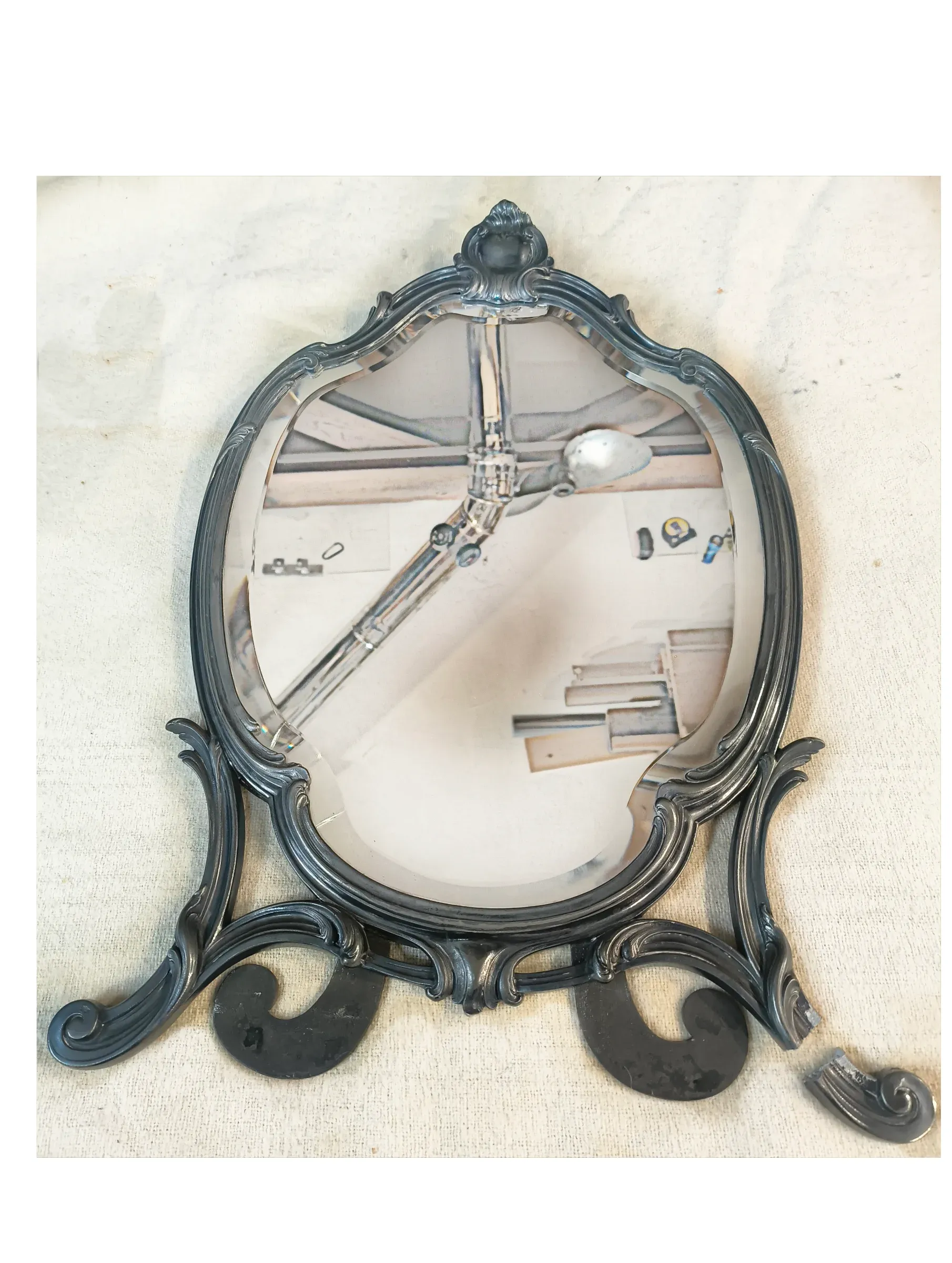 The mirror as received having lost a foot